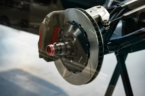 Exposed brake disc and caliper assembly